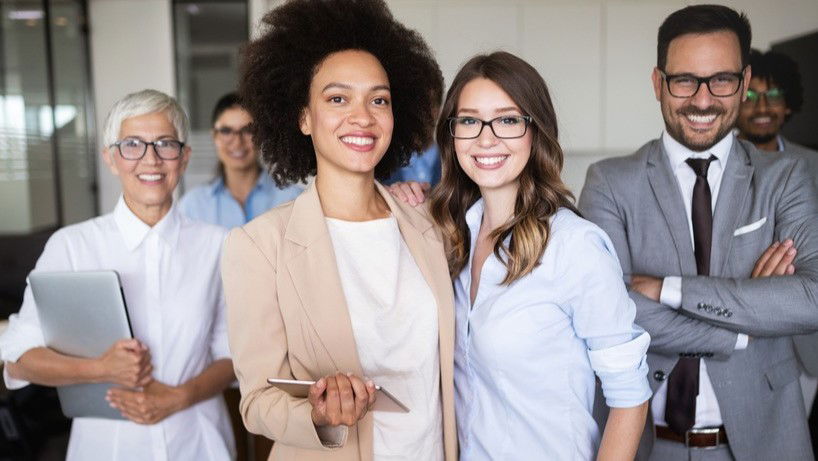 Group of adults wearing business casual clothing.